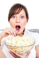 24714210-young-woman-eating-popcorn.jpg