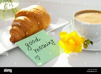 eine-tasse-aromatischen-kaffee-mit-croissant-wunderschones-gelbes-freesia-und-eine-gute-morgen...jpg